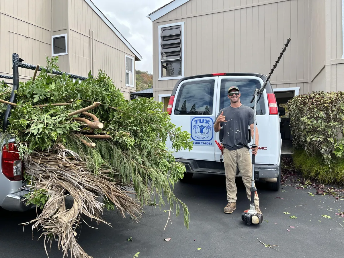 Ryan Tucker in front of his work van at a clients property.